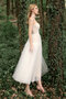 Robe de mariée textile en tulle en plage charme romantique attirent