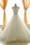 Robe de mariée fermeutre eclair longueur au ras du sol ligne a cordon textile en tulle