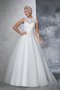 Robe de mariée longue appliques manche nulle elevé longueur au ras du sol