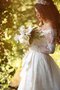 Robe de mariée luxueux plissage avec manche longue de traîne mi-longue en dentelle
