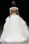 Robe de mariée sage textile en tulle noeud avec manche épeules enveloppants jusqu'au sol