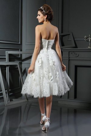 Robe de mariée col en forme de cœur manche nulle en satin ruché de princesse