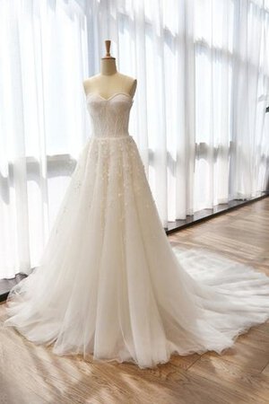 Robe de mariée manche nulle en tulle avec fleurs longueru au niveau de sol fermeutre eclair