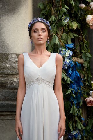 Robe de mariée longue ligne a fermeutre eclair manche nulle jusqu'au sol