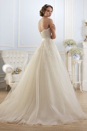 Robe de mariée longue dos nu de traîne courte decoration en fleur de bustier