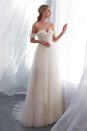 Robe de mariée manche nulle jusqu'au sol textile en tulle charme charmeuse