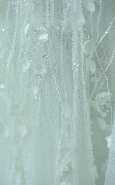 Robe de mariée manche nulle en tulle avec fleurs longueru au niveau de sol fermeutre eclair
